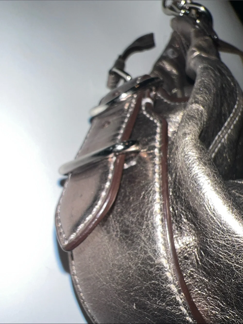 Coach Madison Maggie hobo shoulder bag featuring a metallic gunmetal leather